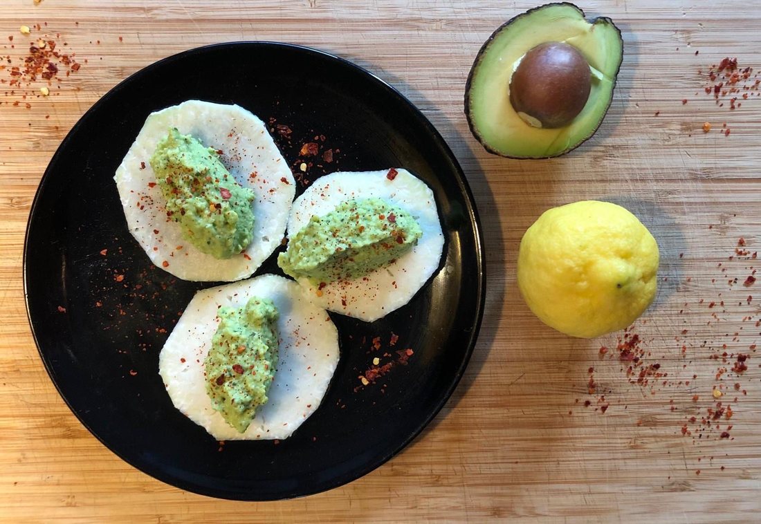 Avocado and basil cream on crisp vegetable slices