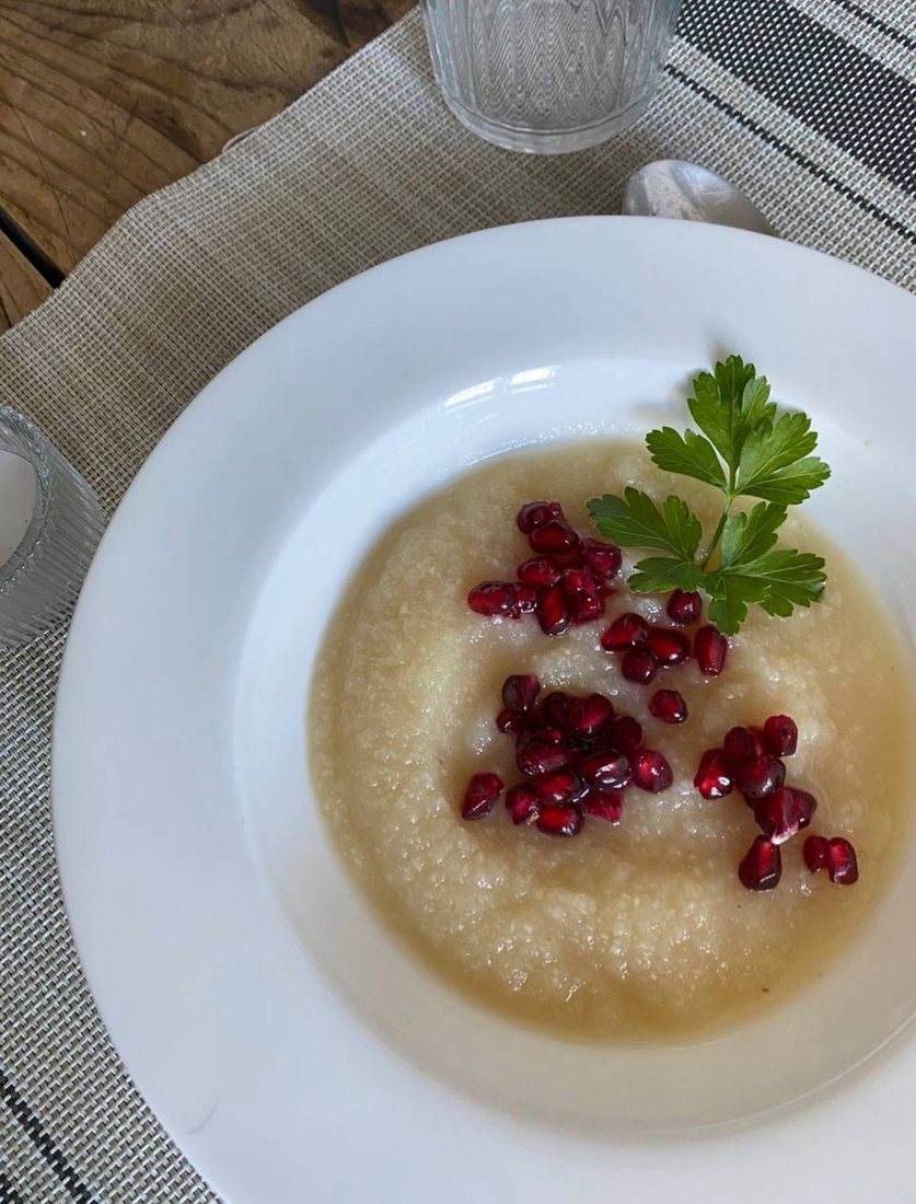Creamy cauliflower soup with pomegranate